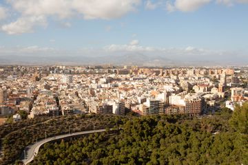 Cityscape view of Alicante with a mountain the far background