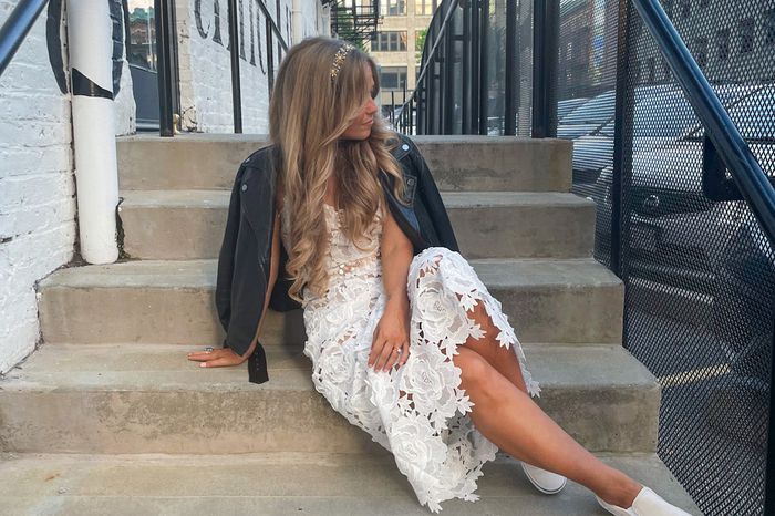 A bride sitting on a step in Providence, Rhode Island 