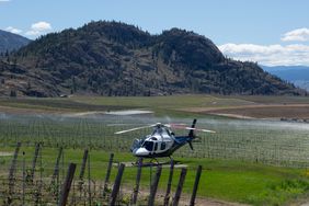 A helicopter landing in Okanagan Valley in British Columbia 