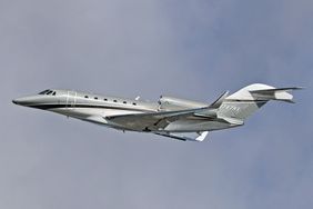 A Cessna 750 Citation X Plus, owned by a private company, is taking off from Barcelona Airport 