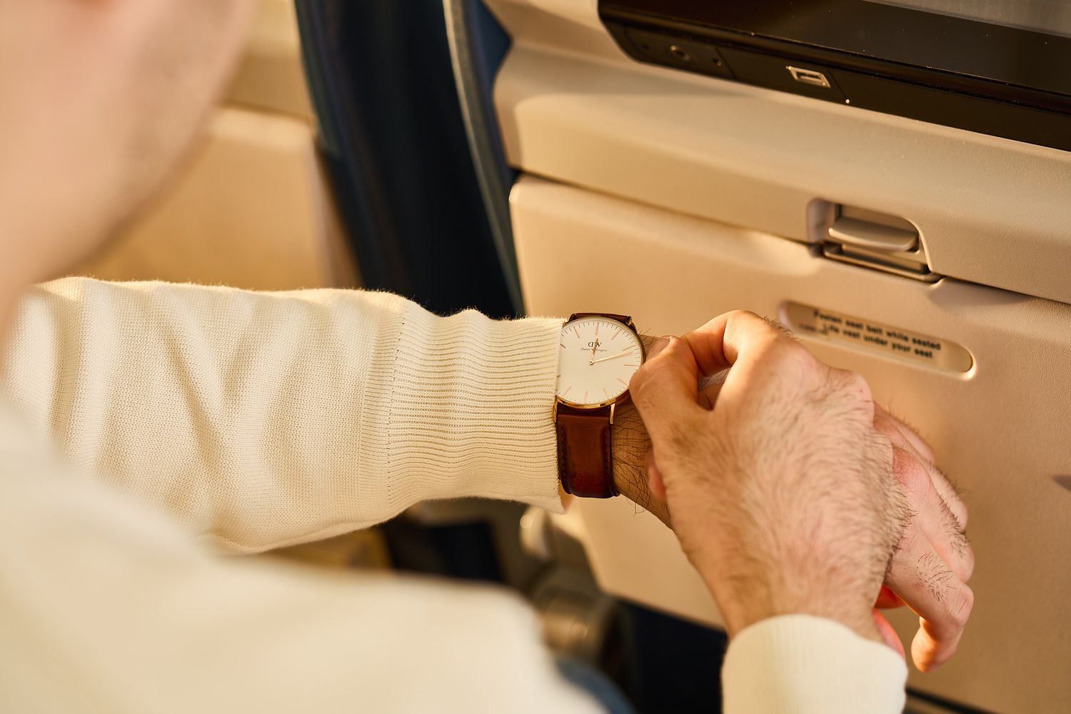 A man adjusting his watch