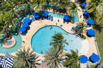 Aerial view of the pool at Pelican Grand Beach Resort