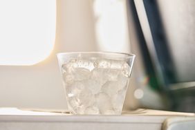 Cup of ice on a plane