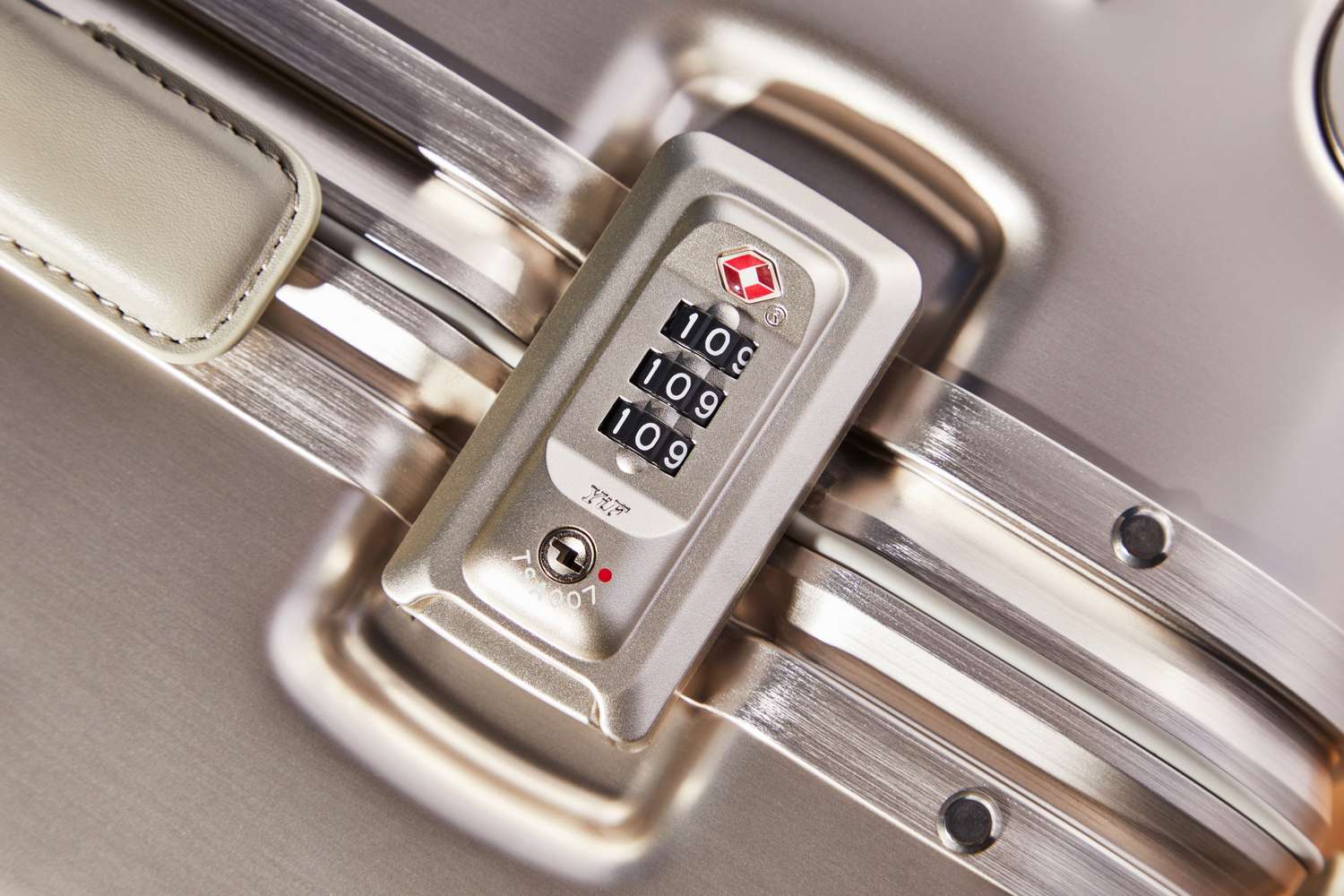 Close-up of a comination lock on an Arlo Skye The Frame Carry-on Max: Aluminum Edition