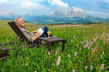 Rick Steves Taking a break from filming in Italy's Dolomites