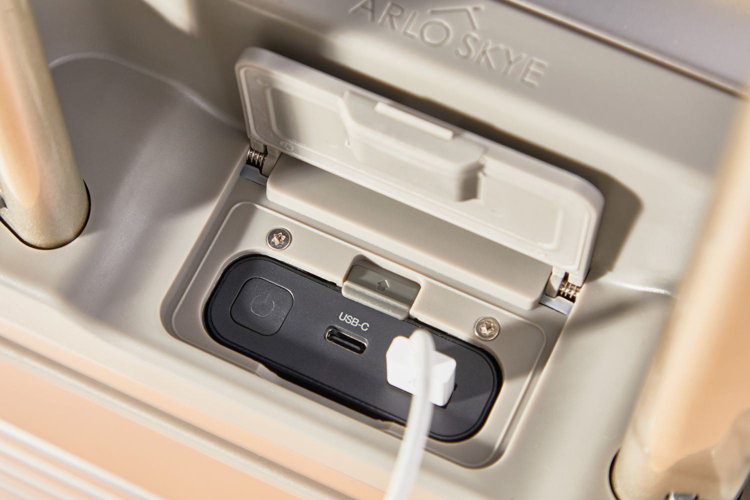 Close-up of the USB port on an Arlo Skye The Frame Carry-on Max: Aluminum Edition