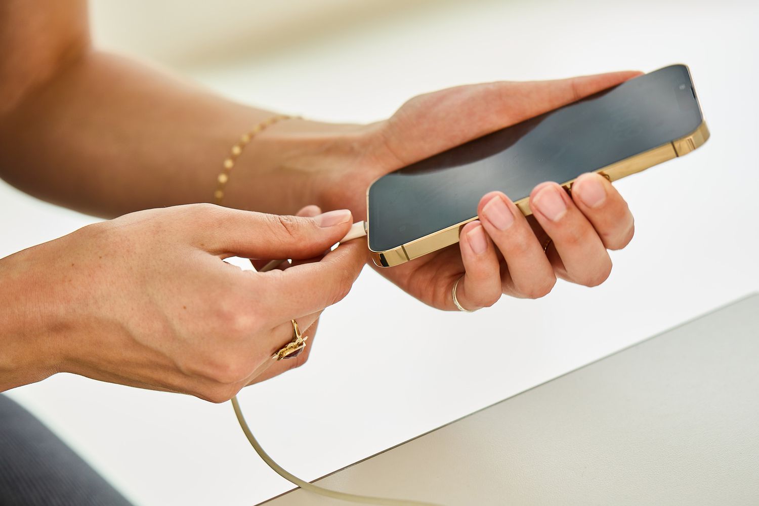 A person charging their cell phone