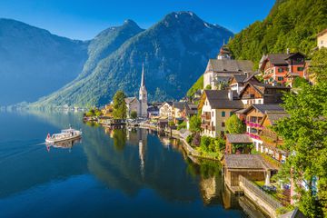 Classic view of Hallstatt with ship at sunrise, Salzkammergut, Austria