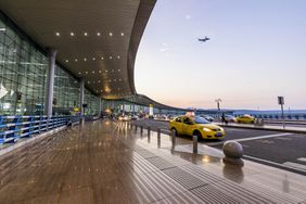 Airport drop off lane with taxis in the early morning 