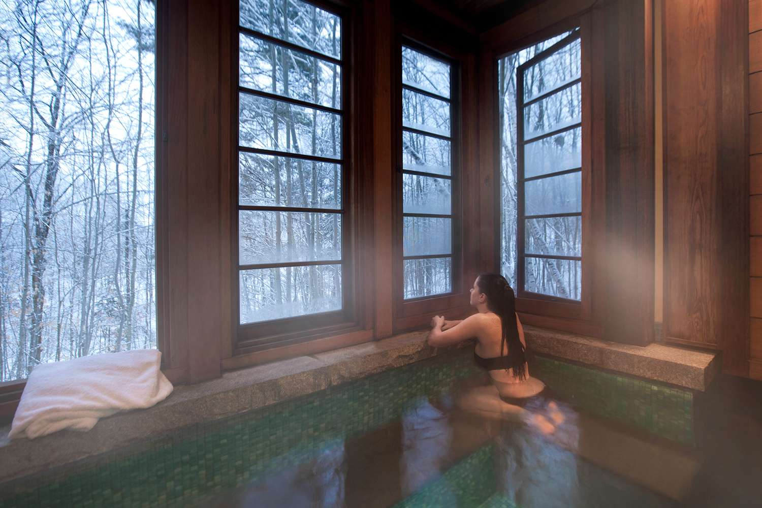 A woman enjoying the spa at Twin Farms during the wintertime