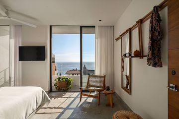 Guest room with an ocean view at The Tryst Puerto Vallarta 