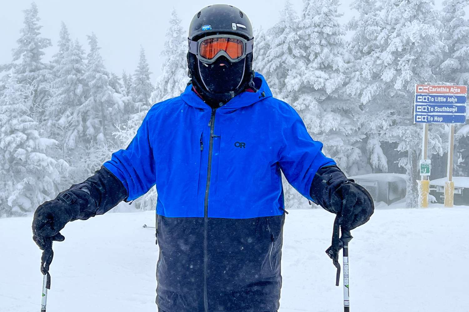 Person stands in the snow wearing an Outdoor Research Carbide