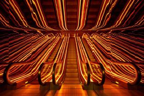 Public Hotel amber-glowing escalators