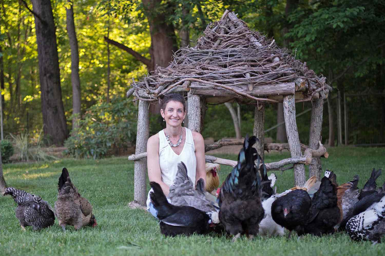 Kathy Shea Mormino in yard with chickens