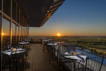 Sun setting on the central new york country side as seen from the outdoor dining patio at TS Steakhouse