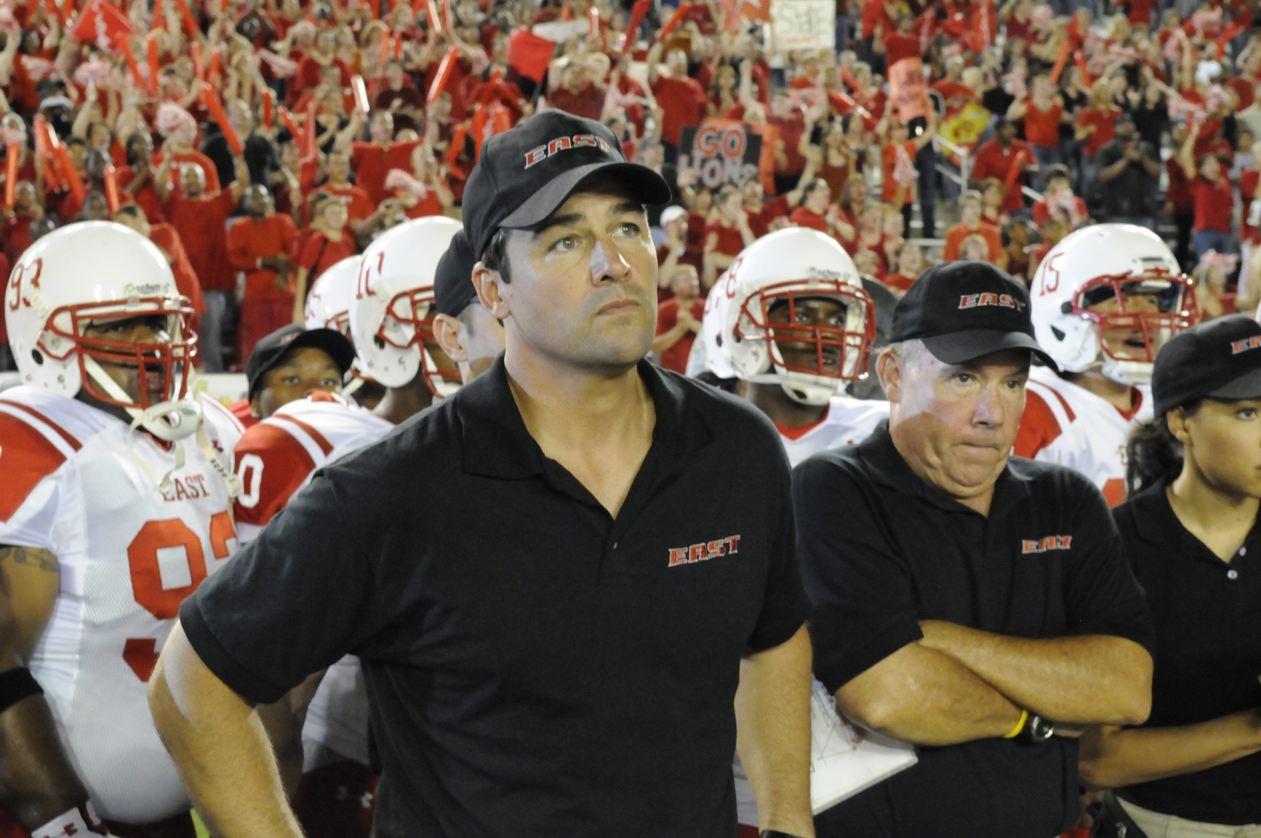 Kyle Chandler as Coach Eric Taylor, Timothy F. Crowley as Coach Crowley in Friday Night Lights