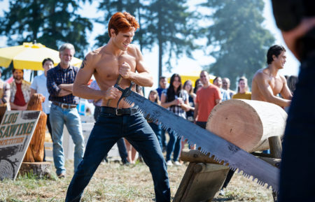 KJ Apa cutting wood on Riverdale - Season 6 premiere