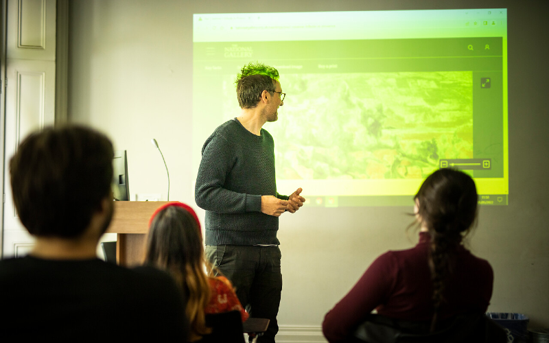 A UCL lecturer gives a presentation at the Slade.