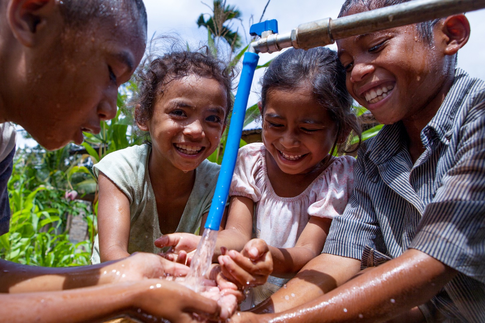 children at water tap