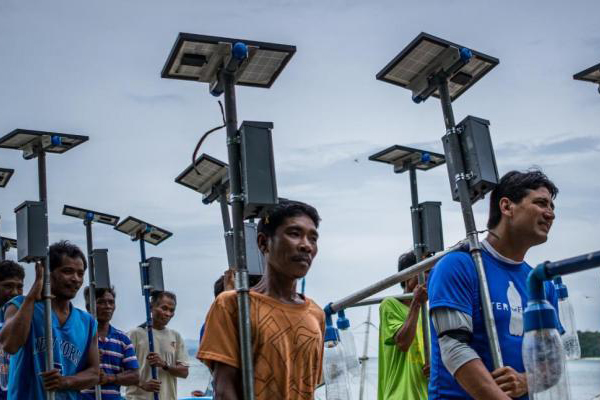 men carrying light sources