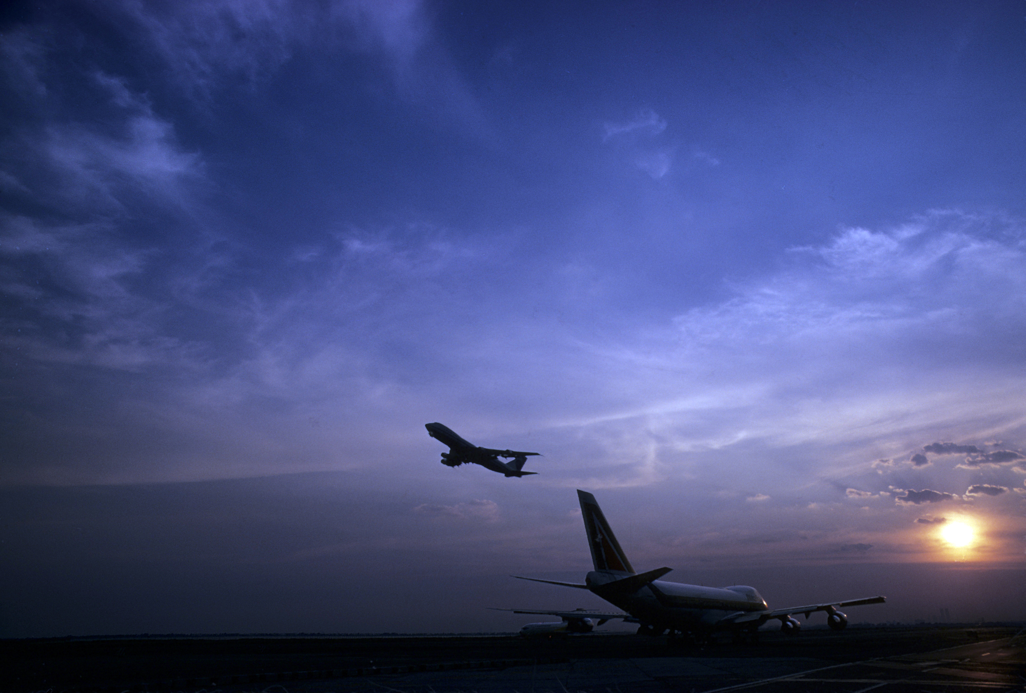 airplanes taking off on runway