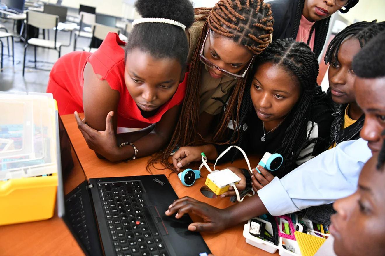 girls gathered around computer screen