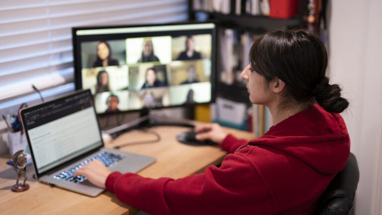 A student participates in an online class at home.