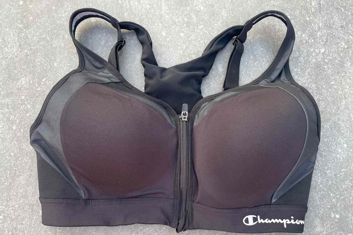 The Champion Motion Control Zip Sports Bra Wirefree on concrete