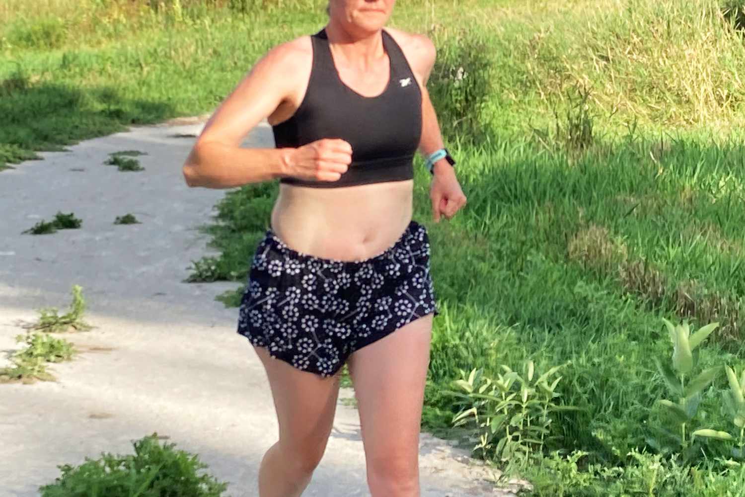 A person exercising in the Reebok Running Essentials High-Impact Sports Bra