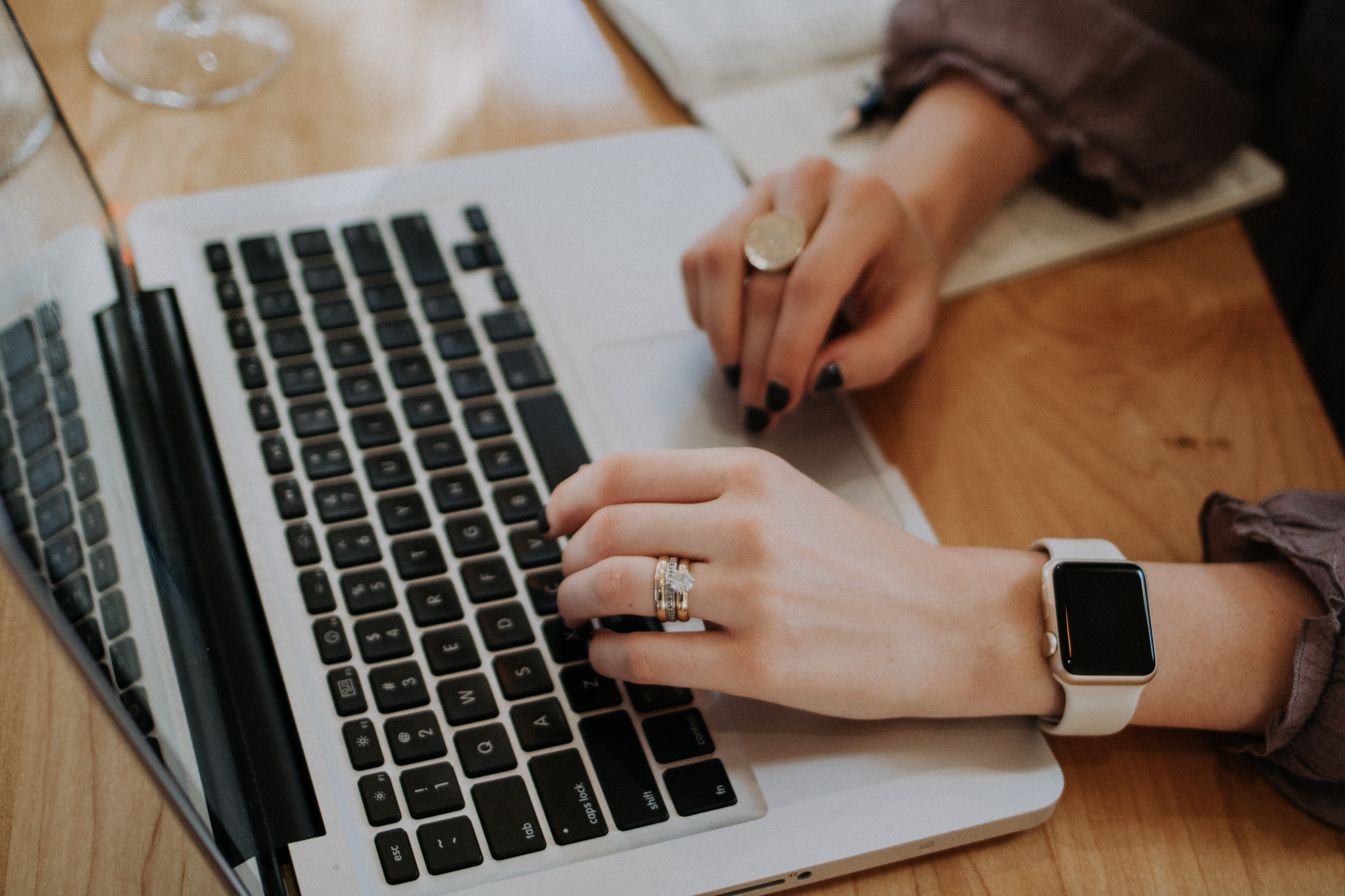 hands at a laptop