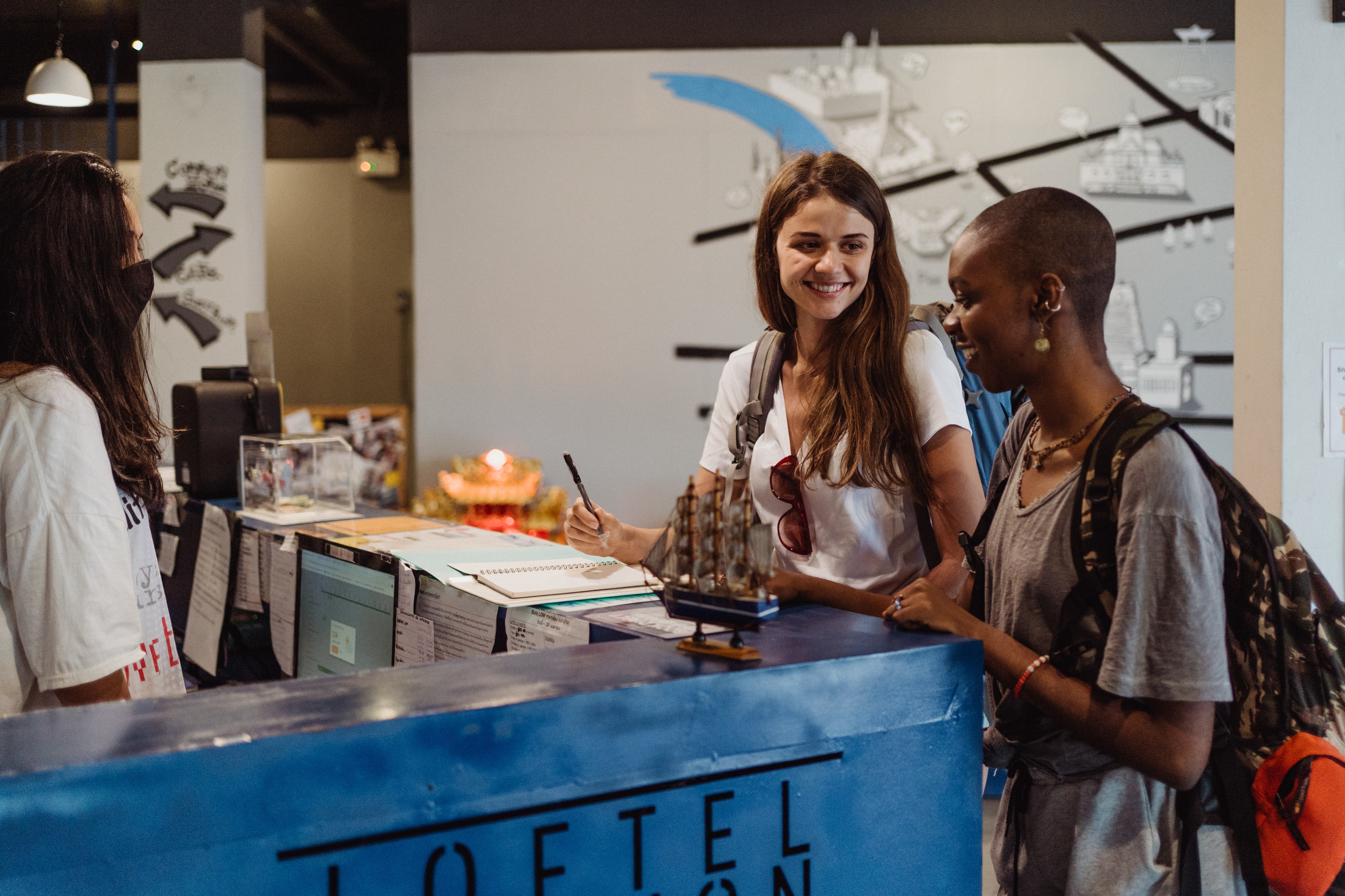 two people at a reception desk