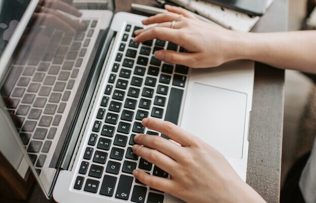 hands at a laptop