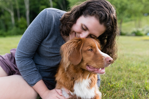 owner kissing dog