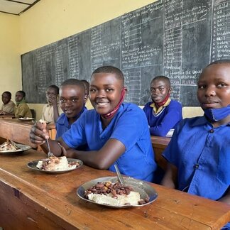 Julienne eating fortified wholegrain maize meal at Kibirizi primary school in southern Rwanda. WFP is providing nutritious school meals to help improve children’s concentration and reduce absenteeism. Photo: WFP/Emily FREDENBERG