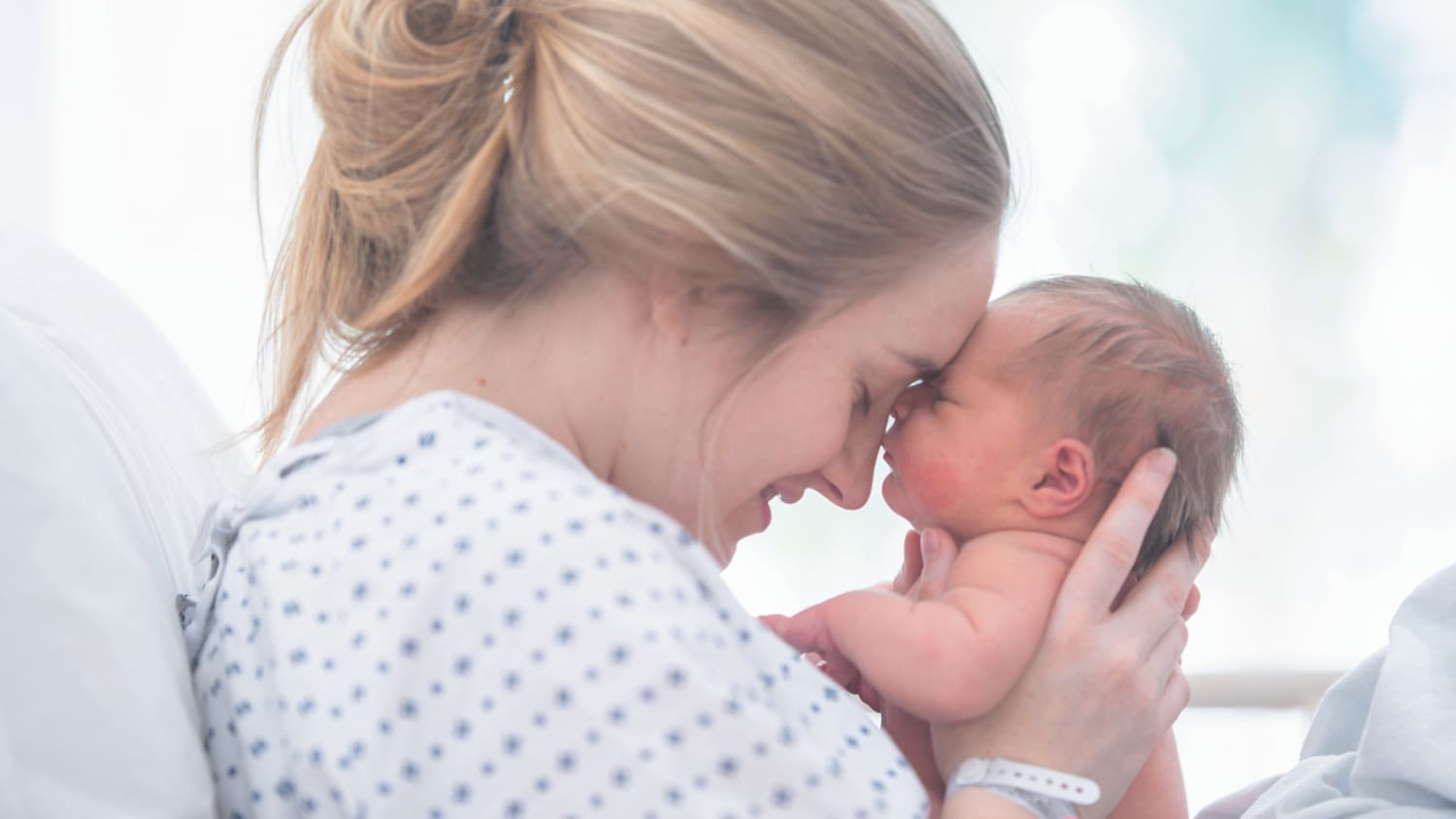 newborn baby and mother, after receiving an epidural during childbirth